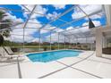 Relaxing screened-in pool with lounge chairs perfect for enjoying sunny days at 2503 Calla Lily Cv, Kissimmee, FL 34758