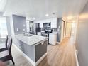 Bright kitchen with stainless steel appliances, granite countertops, and modern white cabinetry at 2735 N Poinciana Blvd # 95, Kissimmee, FL 34746