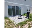 Small backyard patio featuring a table and grill at 312 Lake Smart Cir, Winter Haven, FL 33881