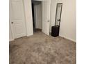 Neutral bedroom with carpeted floor and white trim at 312 Lake Smart Cir, Winter Haven, FL 33881