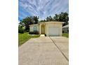 Charming single-Gathering home with manicured lawn, mature trees, and an attached one car garage at 453 Alston Dr, Orlando, FL 32835