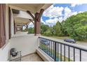 Balcony view featuring sturdy posts, metal railings, and a street view at 5103 Jones Rd, St Cloud, FL 34771