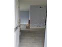 Inviting entryway featuring tile flooring and soothing blue-grey wall paint leading to the living space at 5144 Picadilly Circus Ct # 2, Orlando, FL 32839