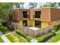 Townhome featuring a fenced back patio perfect for entertaining and enjoying outdoor living and beautiful skies at 5251 Brook Ct # 242, Orlando, FL 32811