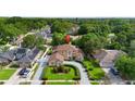Stunning two-story home with manicured landscaping and a circular driveway in a lush neighborhood at 7846 Snowberry Cir, Orlando, FL 32819