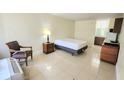 A compact living space featuring tile floors and natural light at 7900 S Orange Blossom Trl # 2102, Orlando, FL 32809