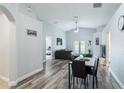 Bright living area with wood flooring, French doors and modern furnishings at 1659 Sage Creek Ct, Orlando, FL 32824