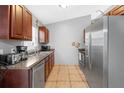 Functional kitchen featuring stainless steel appliances and ample countertop space at 166 Paradise Island Dr, Haines City, FL 33844