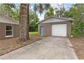 Exterior view of detached garage and additional property features at 1800 Banyan St, Orange City, FL 32763