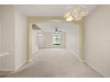 Spacious living area with neutral carpeting and a ceiling fan at 2050 Island Walk Dr, Orlando, FL 32824