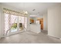 Bright living area featuring a doorway and French doors leading to the outside at 2050 Island Walk Dr, Orlando, FL 32824
