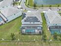 This home has a fenced in back yard and a screened in pool at 2417 Shanti Dr, Kissimmee, FL 34746