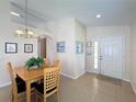 Inviting home foyer with decorative details and a front door with sidelight windows at 2649 Hemingway Ave, Haines City, FL 33844