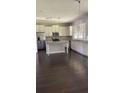 Bright kitchen with white cabinets, stainless steel appliances, and a center island at 2813 Roseglen Way, Orlando, FL 32812