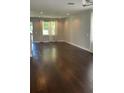 Spacious living room featuring hardwood floors, recessed lighting, and large windows at 2813 Roseglen Way, Orlando, FL 32812