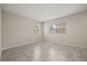 A bright bedroom filled with natural light from its windows, offering a serene and inviting space at 2966 Aqua Virgo Loop # 16, Orlando, FL 32837