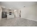 Bright and spacious living room featuring tile floors and neutral decor, perfect for relaxation and entertaining guests at 2966 Aqua Virgo Loop # 16, Orlando, FL 32837