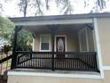 Inviting front porch with black railings and supports, offering a welcoming entrance at 3029 Azalea Ave, Lake Wales, FL 33898
