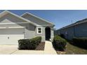 Inviting home exterior with lush landscaping and a well-manicured front yard at 30346 Armenia Rd, Leesburg, FL 34748