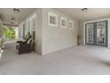 Spacious covered front porch with sitting area and direct access into the house at 3310 Cat Brier Trl, Harmony, FL 34773