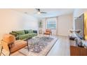 Stylish living room with modern furnishings, neutral tones, a ceiling fan, and lots of natural light at 4768 Tangerine Ave # 4768, Winter Park, FL 32792