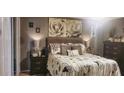 Relaxing main bedroom with a comfortable bed, stylish decor, and soft, ambient lighting at 505 Oak Dr, Tavares, FL 32778