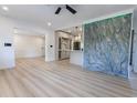 Bright, open-concept living room with updated kitchen featuring modern cabinets and marble countertops at 722 Carlson Dr, Orlando, FL 32804