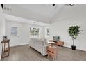 Spacious living room with luxury vinyl flooring, natural light, and modern furnishings at 1501 Missouri Ave, St Cloud, FL 34769