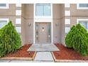 Inviting front entrance with well-maintained landscaping, including decorative rock and manicured shrubbery at 1912 Maury Rd, St Cloud, FL 34771