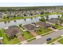 An aerial view of a neighborhood highlighting the large lots, lake views and green spaces at 3797 Briarwood Estates Cir, St Cloud, FL 34772