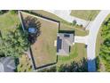 Aerial view of home featuring large fenced yard and solar panels on the roof at 10 Pine Track Trl, Ocala, FL 34472