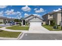 Charming single-Gathering home with a well-maintained lawn, attached two-car garage and neutral color palette at 2211 Tay Wes Dr, St Cloud, FL 34771