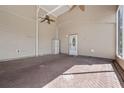 Covered outdoor living space showing the brick floor, ceiling fans, and access door to the home at 2343 St George Dr, Davenport, FL 33837