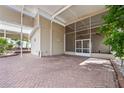Spacious, covered, screened outdoor living space featuring a brick floor and outdoor ceiling fans for a relaxing atmosphere at 2343 St George Dr, Davenport, FL 33837