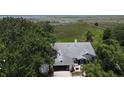 Bird's eye view of home with mature trees, waterfront access and expansive lawn at 2700 Cherokee Rd, St Cloud, FL 34772
