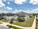 Beautiful two-story home featuring a two-car garage, brick accents, and freshly manicured front yard at 2759 Slash Way, St Cloud, FL 34771