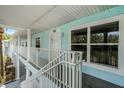 Condo entrance with stairs leading up to a second-story unit, showing the unit number at 3111 Sun Lake Ct # B, Kissimmee, FL 34747