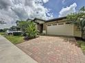 Beautiful single-story home with brick driveway, 2-car garage, and well-maintained landscaping at 3193 Crispin Cir, Harmony, FL 34773