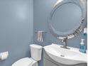 Cozy bathroom features a modern sink, large decorative mirror and neutral paint at 3214 Herons Point Cir, Kissimmee, FL 34741