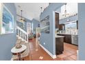 Open-concept entryway with views into the living, dining and kitchen area boasts neutral paint and tile floors at 3214 Herons Point Cir, Kissimmee, FL 34741