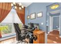 Home office with natural light, tile flooring, and neutral walls, is perfect for working from home at 3214 Herons Point Cir, Kissimmee, FL 34741