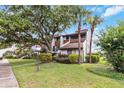 Charming townhouse with mature trees, lush landscaping, and a beautiful green lawn at 4570 Tower Pine Rd # Ge, Orlando, FL 32839