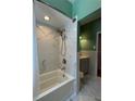 Modern bathroom featuring a sleek vanity, toilet, shower head, and a beautifully tiled shower and tub combo at 760 Bearcreek Dr, Bartow, FL 33830