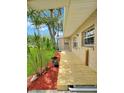 Exterior shot of the home showing a deck surrounded by plants at 760 Bearcreek Dr, Bartow, FL 33830