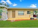 Inviting exterior featuring a wood deck that surrounds the house at 760 Bearcreek Dr, Bartow, FL 33830
