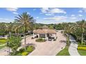 Aerial view of Bella Trae's gated entrance featuring lush landscaping and secure access at 8401 Riverdale Ln # 8401, Davenport, FL 33896