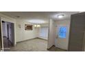 Dining room with elegant lighting, decorative wall trim and wainscoting at 112 Rosewood Ct, Kissimmee, FL 34743