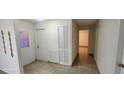 Hallway with closet space and access to other rooms in the home at 112 Rosewood Ct, Kissimmee, FL 34743