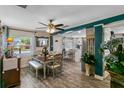 Inviting dining room with a dining table and bench, bright windows, and stylish decor at 1422 Indiana Ave, St Cloud, FL 34769