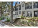 Charming townhome with a white bridge walkway and cozy front porch at 1607 Wilson Ave, Orlando, FL 32804